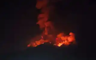 Mount Karangetang Erupts, Incandescent Material Burns Vegetation at the Summit